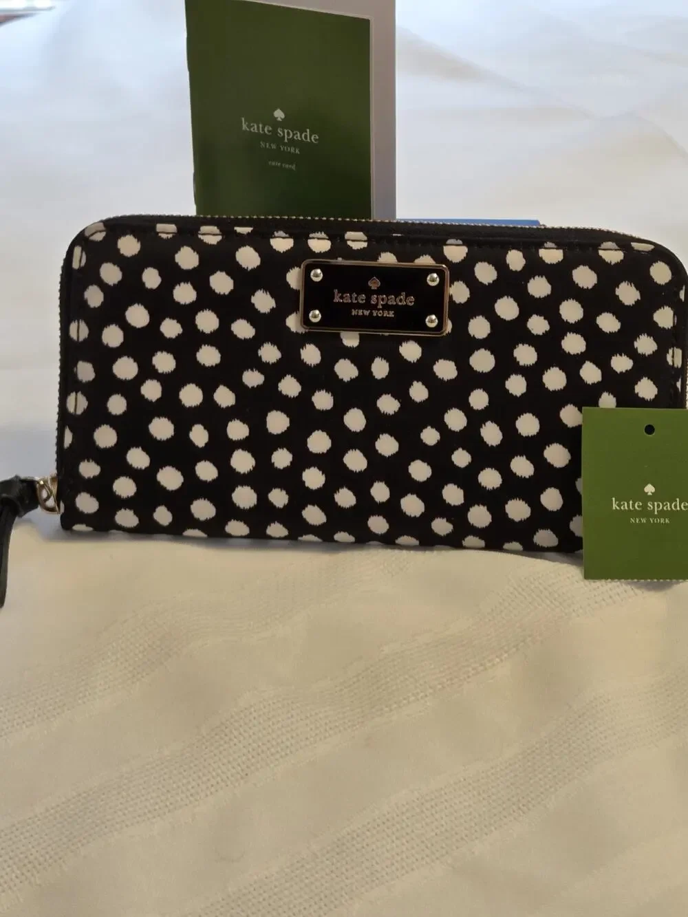 Kate Spade New York black and white polka dot wallet
